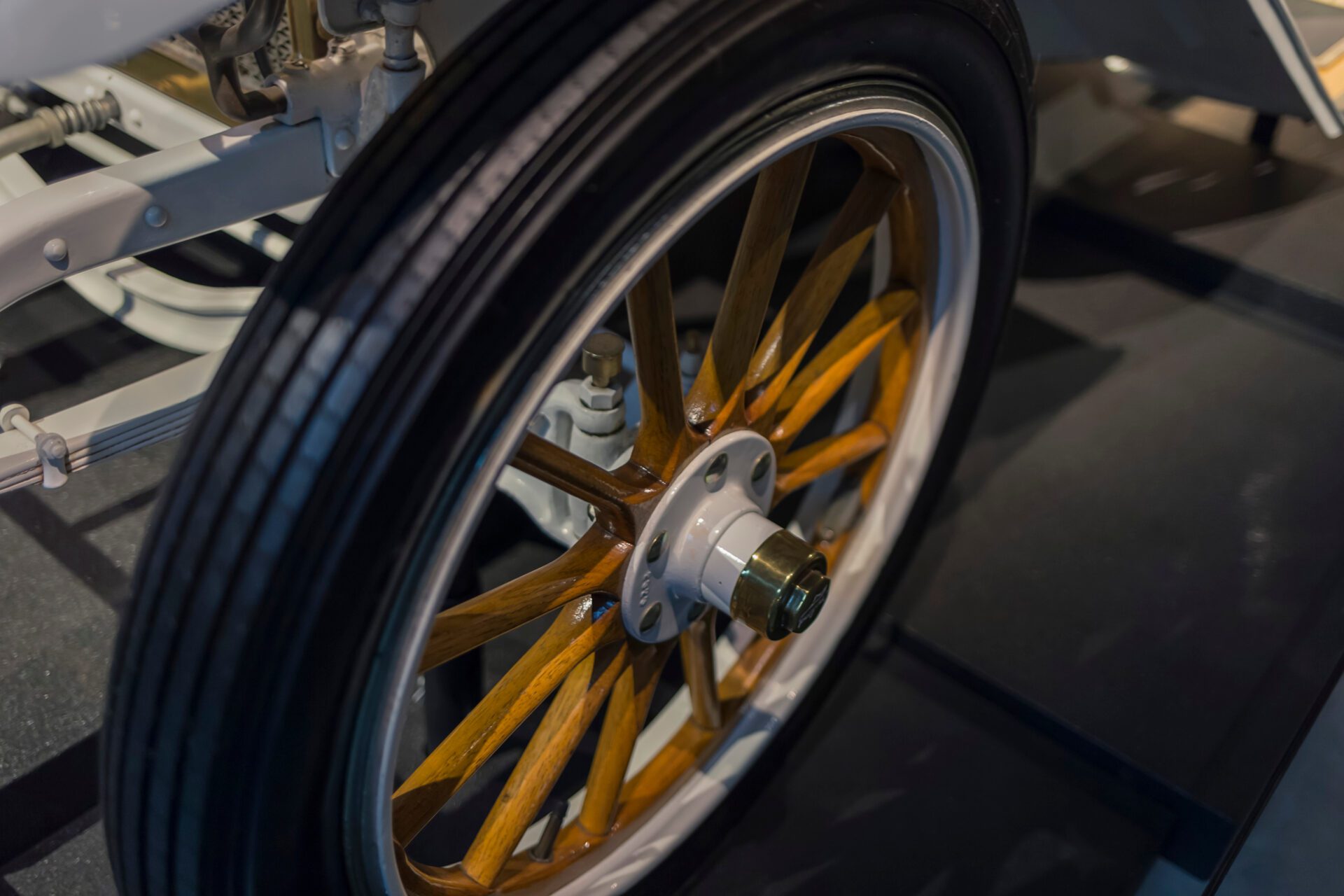 Vintage wooden spoke car wheel. Close-up of wood spokes on a classic vehicle Vintage wooden spoke car wheel. Close-up of wood spokes on a classic vehicle