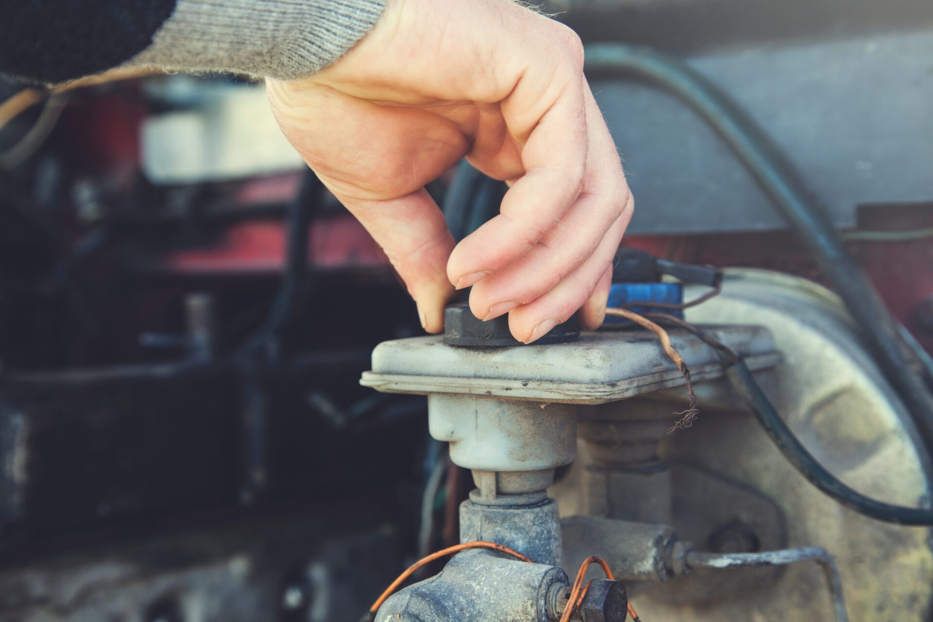 man hand car oil the young worker man hand car oil